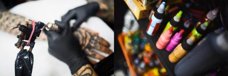 A tattoo artist wearing black gloves works on a client's arm, while various colorful ink bottles are arranged on a nearby shelf.