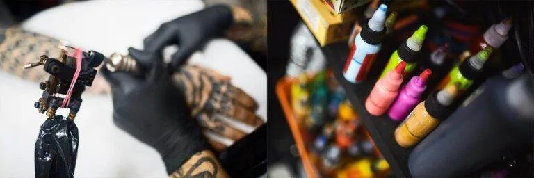 A tattoo artist wearing black gloves works on a client's arm, while various colorful ink bottles are arranged on a nearby shelf.