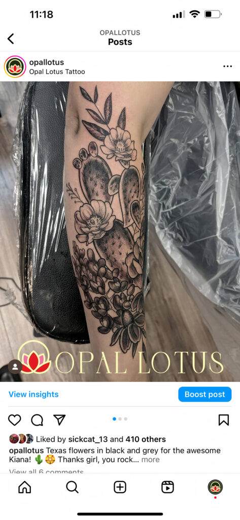 A black and grey tattoo of Texas flowers on a person's calf, created by Opal Lotus Tattoo.