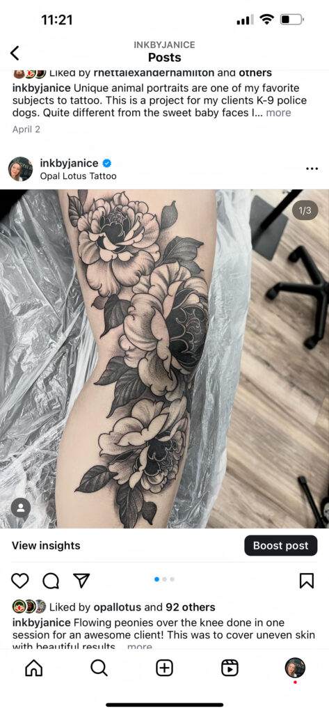 Tattoo of detailed peonies and leaves spanning over the knee on a person's leg. Artist's caption mentions the tattoo covers uneven skin.