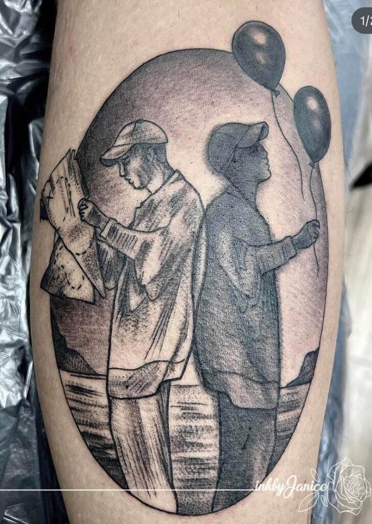 Tattoo of two figures: one reading a map, the other holding two balloons, set against a circular background.